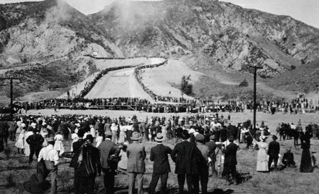 (November 5, 1913)* - Crowds watch as the water gates are opened and the Los Angeles Aqueduct water starts to flow down into the San Fernando Valley. William Mulholland, builder of the aqueduct and H. A. Van Norman, Chief Engineer and General Manager, Water Bureau.