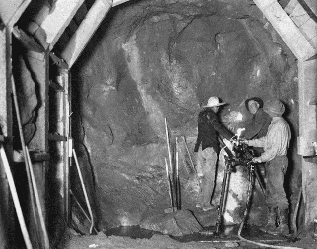 (ca. 1908)* - View of a construction crew drilling in the Elizabeth Tunnel.
