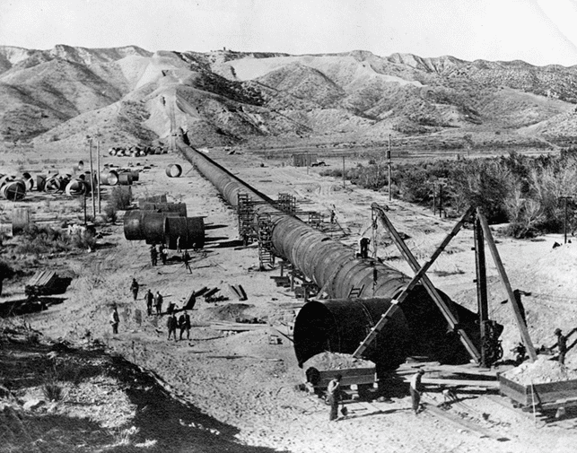 (1910)*^# - Construction of the aqueduct pipe in the Mojave Desert.