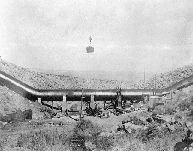 (ca. 1912)* - Due to the extreme pressure caused by water running down the canyons, the sag pipes needed to be supported by huge concrete pillars.