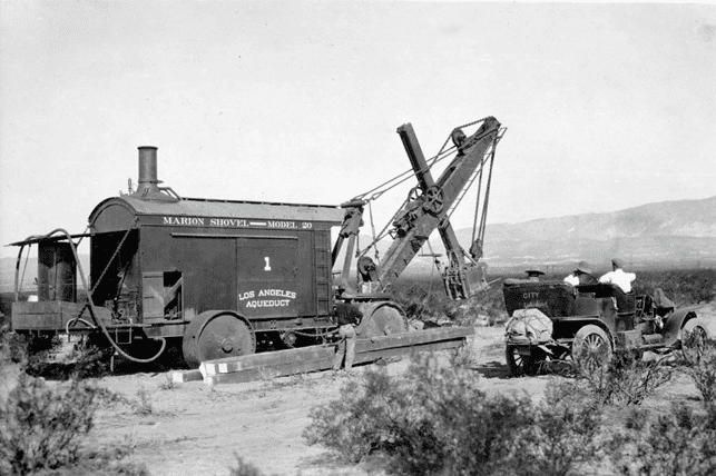 (ca. 1912)^# - Close-up view of steam shovel No. 1 next to early model car.