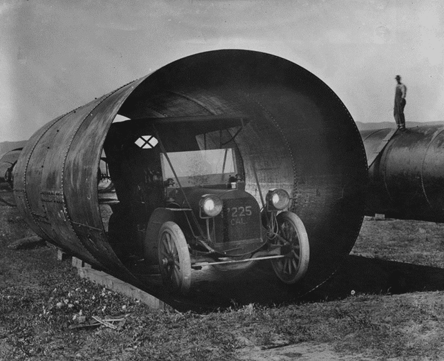 (ca. 1913)* - An automobile fits into a section of siphon pipe used in the Los Angeles Aqueduct.