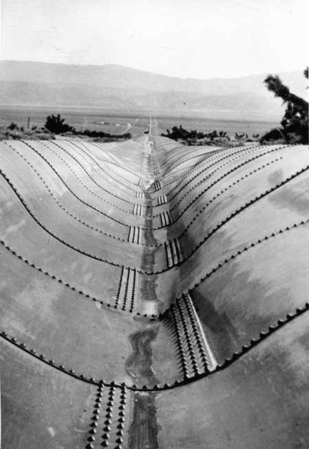 (1914)*^ - View showing the damaged aqueduct pipeline through Antelope Valley resultng from a major 3-day storm in February, 1914 (3-months after the aqueduct's official opening).