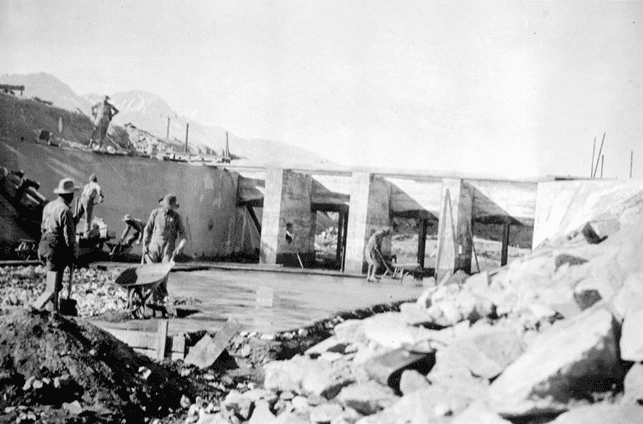 (1912)^*# – View showing workers constructing the regulating gates at the main canal in Owens Valley.