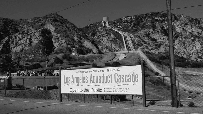 (2013)^** - View showing visitors at the foot of the original Los Angeles Aqueduct Cascade on its 100 year anniversary (left). The cascade for the Second Los Angeles Aqueduct (completed in 1970) is on the right.